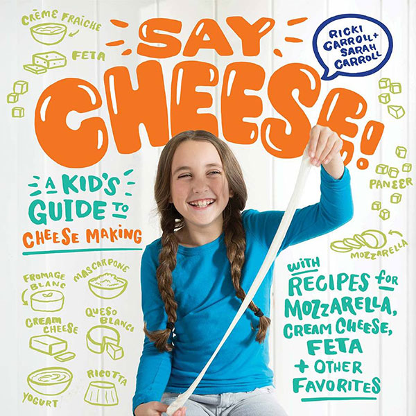 a girl smiling on a Say Cheese book and kit cover