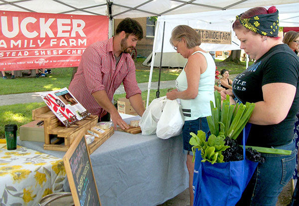 People placing orders at farmers market